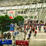UK travelers scanning fingerprints and faces at an automated EU border checkpoint.