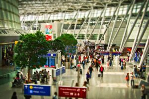 UK travelers scanning fingerprints and faces at an automated EU border checkpoint.
