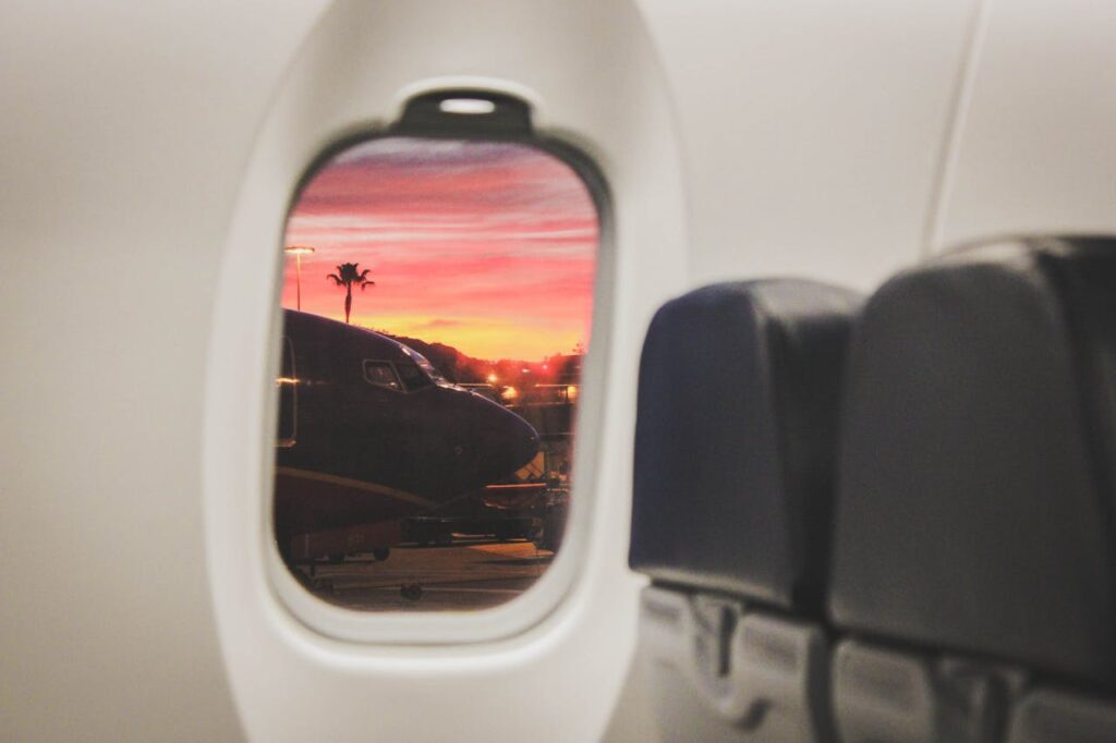 Frequent air flyer looking at a splendid view out of airplane window