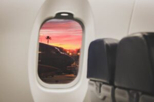 Frequent air flyer looking at a splendid view out of airplane window