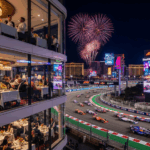 Hilton Grand Vacations’ exclusive trackside clubhouse at the Las Vegas Grand Prix with VIP guests watching F1 cars zoom past.