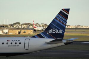 JetBlue standing at airport - attracting passengers with new loyalty program