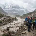 People seen searching for Australian tourists which have gone reportedly missing in Nepal after severe Himalayan flooding