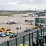 An airport scene as drone-related security threat forces a temporary suspension of flights