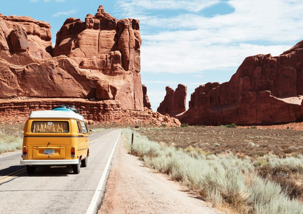 Scenic highway through mountains under open sky representing outdoor and RV travel